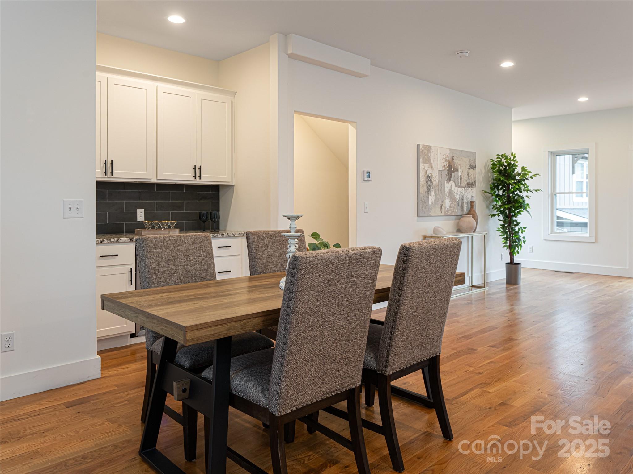 197 Chatham Road Asheville, NC 28804 - Photo 23 of 46 a view of a dining room with furniture and wooden floor