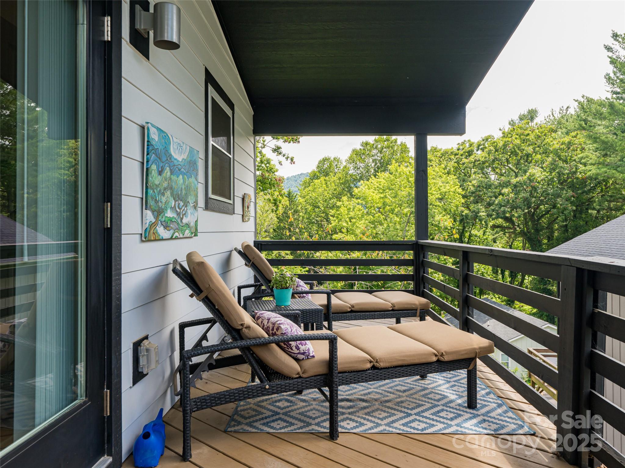 197 Chatham Road Asheville, NC 28804 - Photo 39 of 46 a view of a balcony with wooden floor and outdoor seating