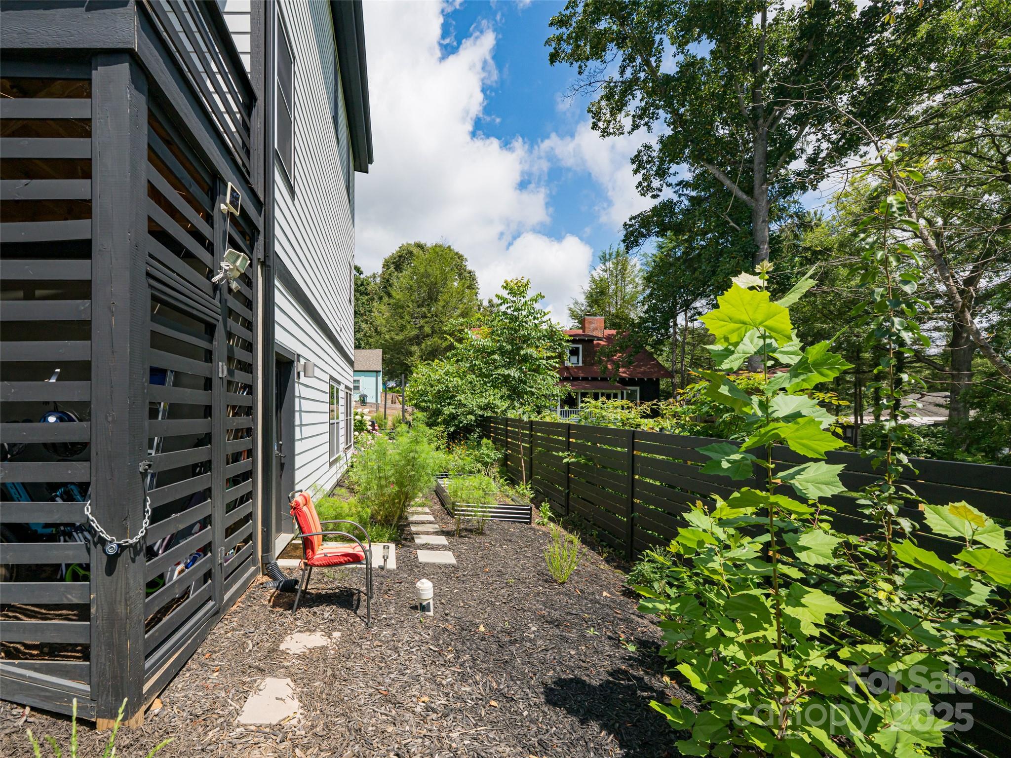 197 Chatham Road Asheville, NC 28804 - Photo 42 of 46 a backyard of a house with lots of green space