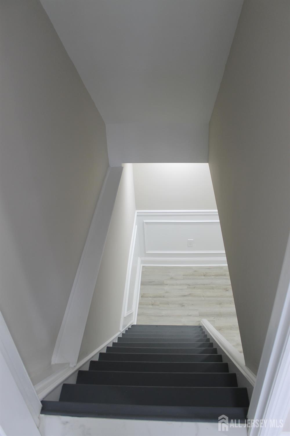 1 Sussex Road East Brunswick, NJ 08816 - Photo 26 of 60 a view of staircase with white walls and white door
