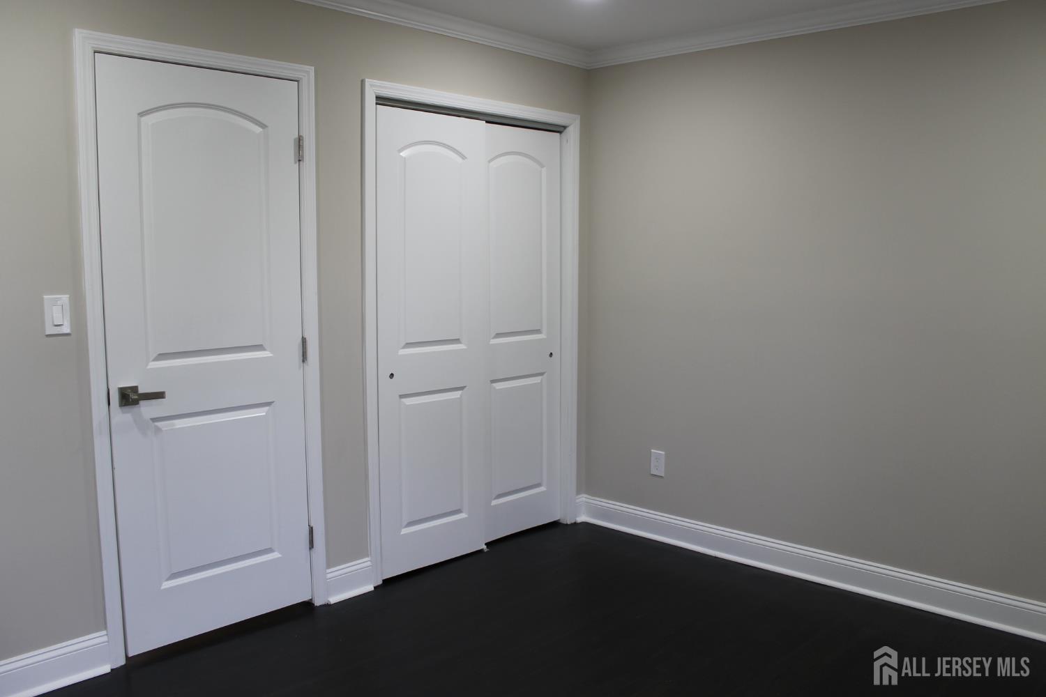 1 Sussex Road East Brunswick, NJ 08816 - Photo 35 of 60 an empty room with wooden floor