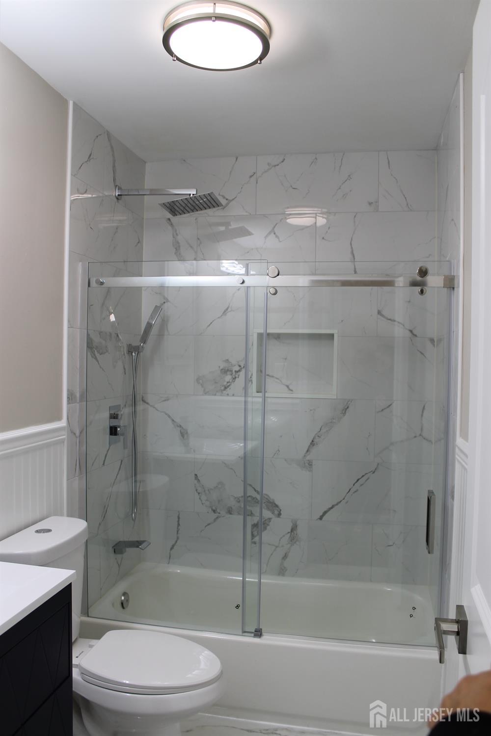 1 Sussex Road East Brunswick, NJ 08816 - Photo 41 of 60 a bathroom with a shower and a toilet