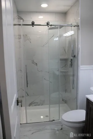 a view of empty room with furniture and window