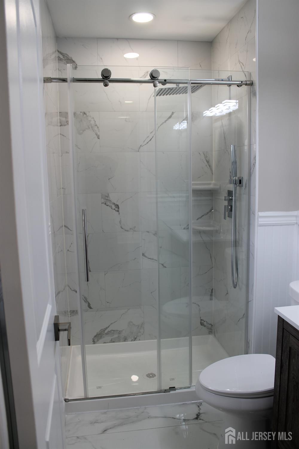 1 Sussex Road East Brunswick, NJ 08816 - Photo 50 of 60 a bathroom with a shower and a toilet