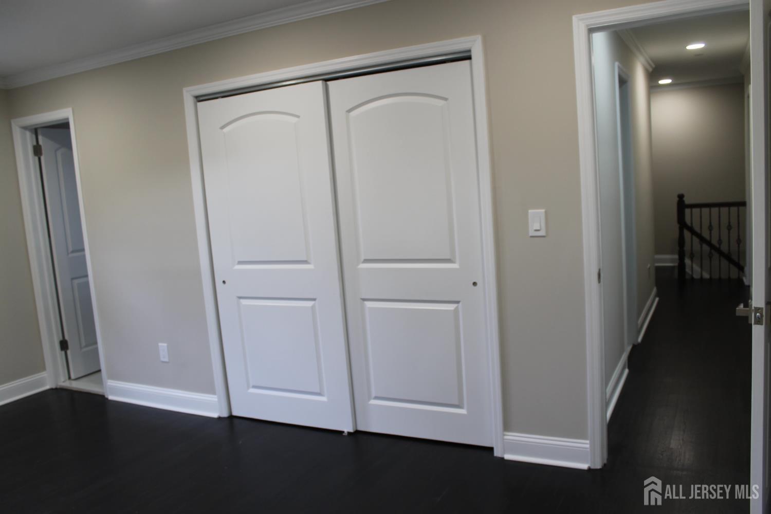 1 Sussex Road East Brunswick, NJ 08816 - Photo 53 of 60 an empty room with wooden floor