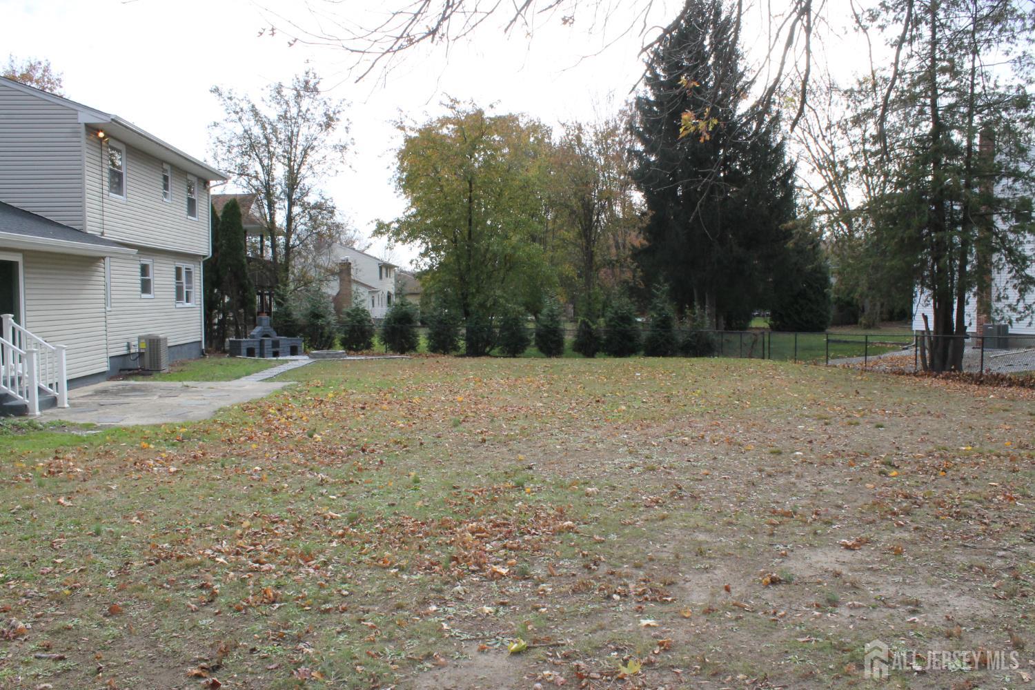1 Sussex Road East Brunswick, NJ 08816 - Photo 55 of 60 a view of a field with trees in the background