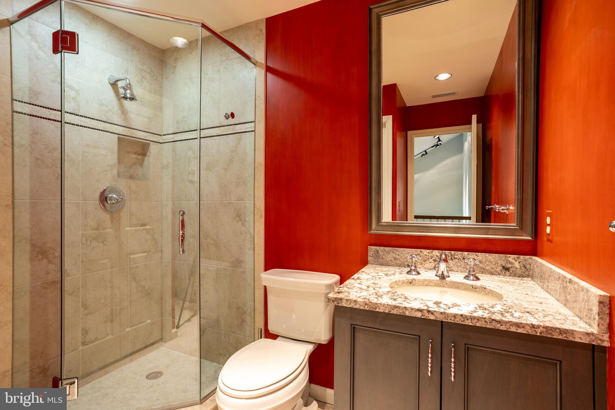 63 Raisin Tree Circle Baltimore, MD 21208 - Photo 41 of 57 a bathroom with a granite countertop sink toilet and shower