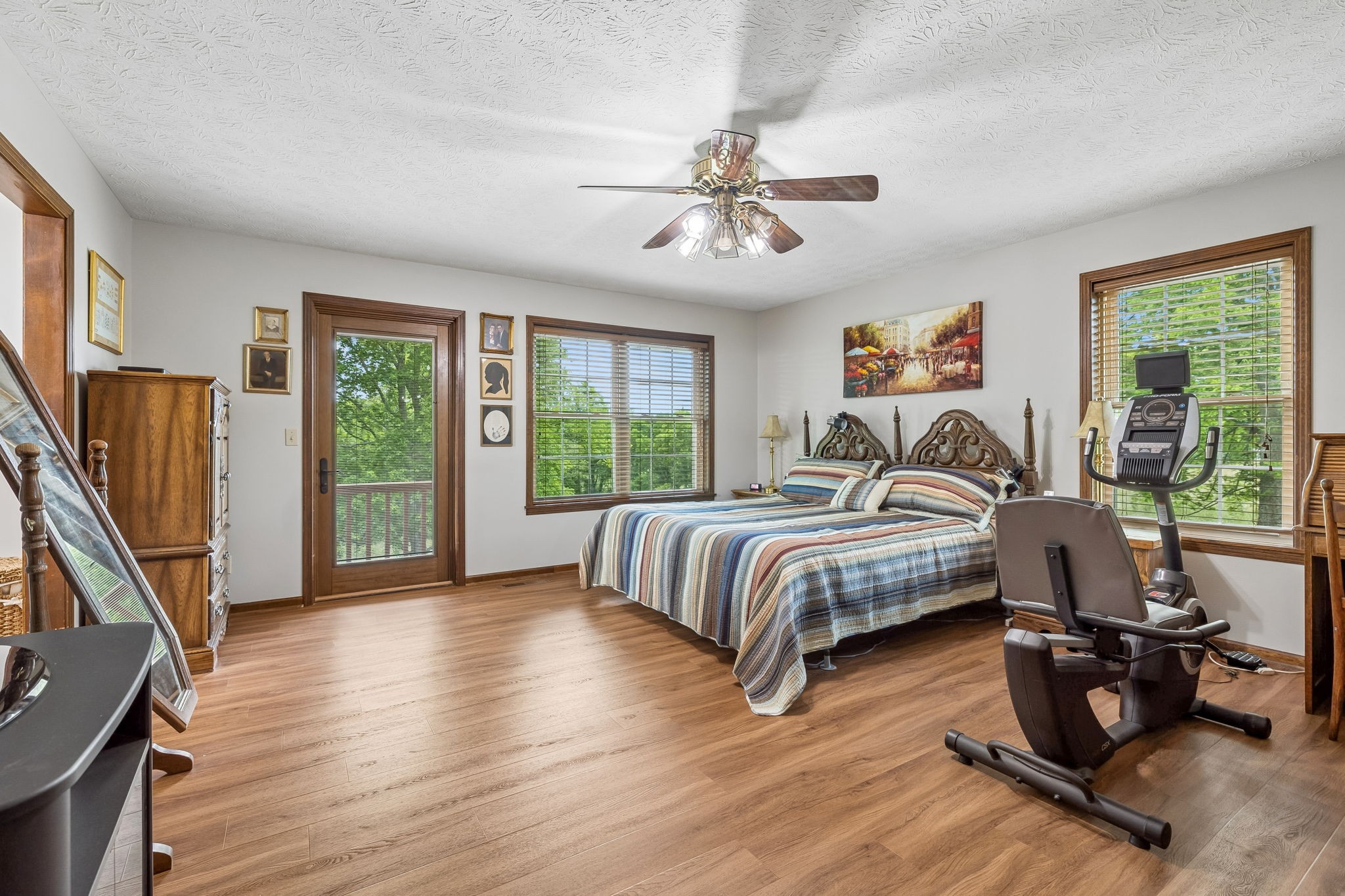 20 Riverbend Lane Carthage, TN 37030 - Photo 24 of 71 a bedroom with a large bed a flat screen tv and a large window with wooden floor