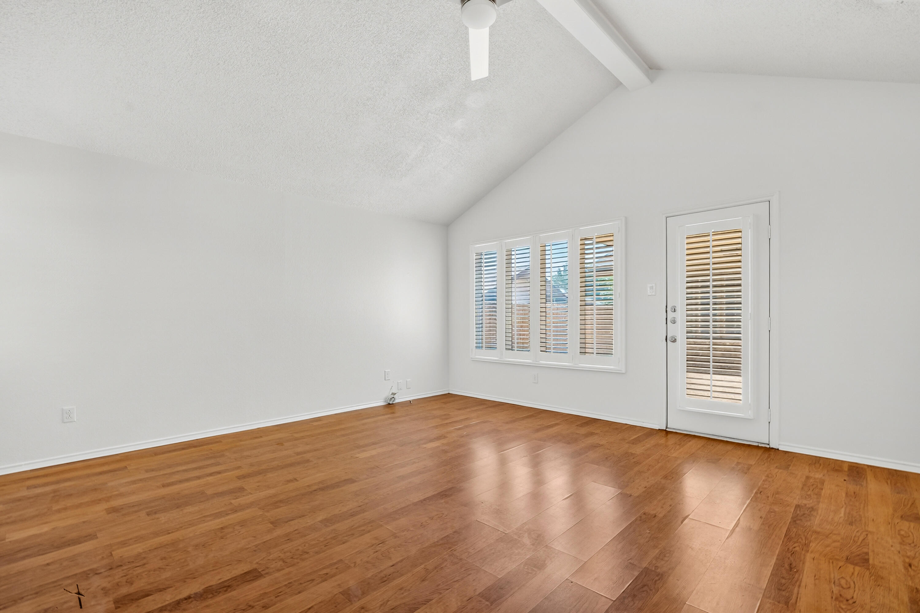 5221 84th Street Lubbock, TX 79424 - Photo 7 of 26 a view of empty room with wooden floor and fan