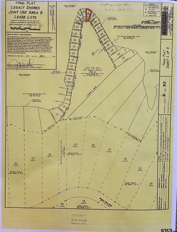 a view of a park with iron fence