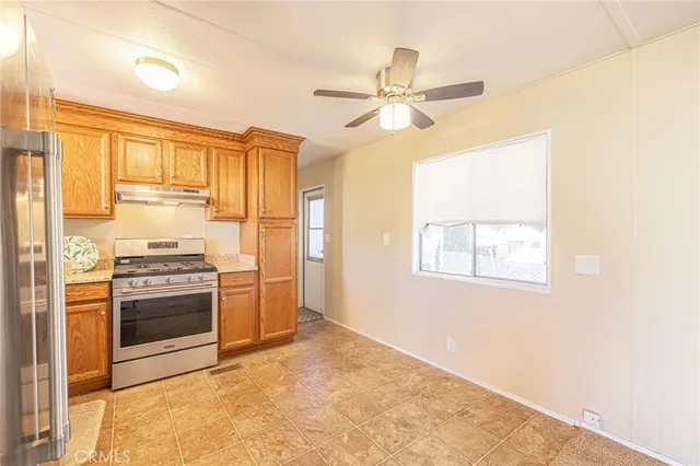 a kitchen with stainless steel appliances a stove and a refrigerator