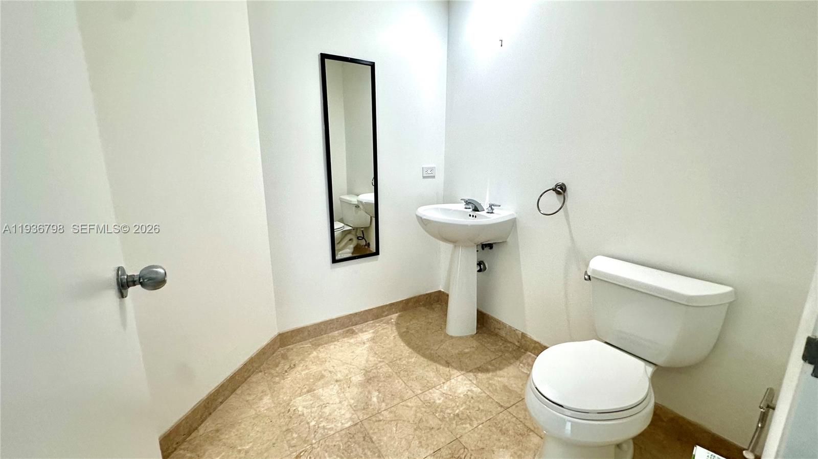 801 Brickell Key Boulevard, Unit 2707 Miami, FL 33131 - Photo 12 of 26 a bathroom with a sink and toilet