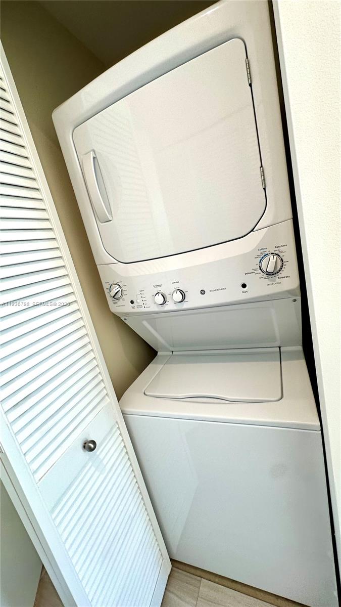801 Brickell Key Boulevard, Unit 2707 Miami, FL 33131 - Photo 20 of 26 a view of washer and dryer