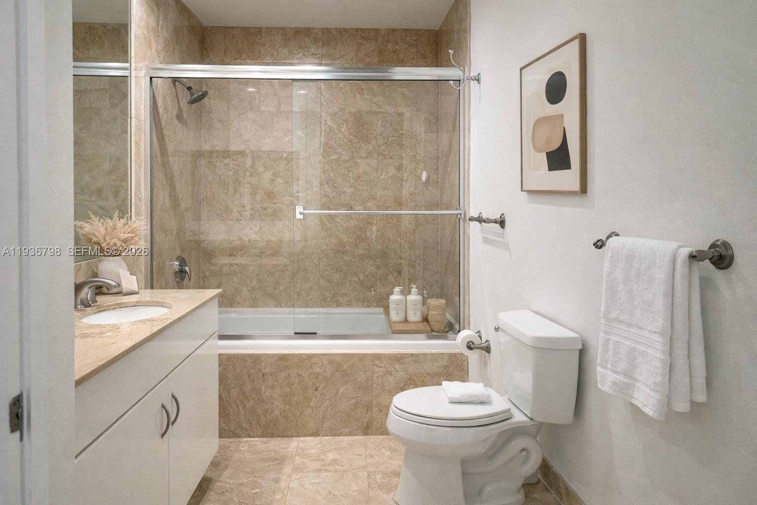 801 Brickell Key Boulevard, Unit 2707 Miami, FL 33131 - Photo 7 of 26 a bathroom with a sink toilet and shower