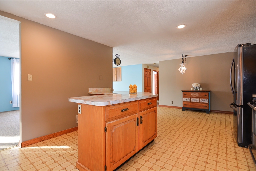 73 Drew Road Derry, NH 03038 - Photo 12 of 42 a spacious bathroom with a double vanity sink and a mirror