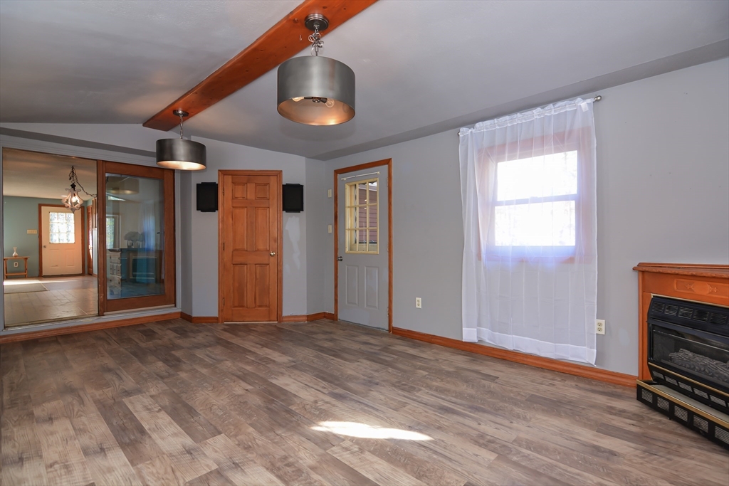 73 Drew Road Derry, NH 03038 - Photo 15 of 42 wooden floor in an empty room with a window
