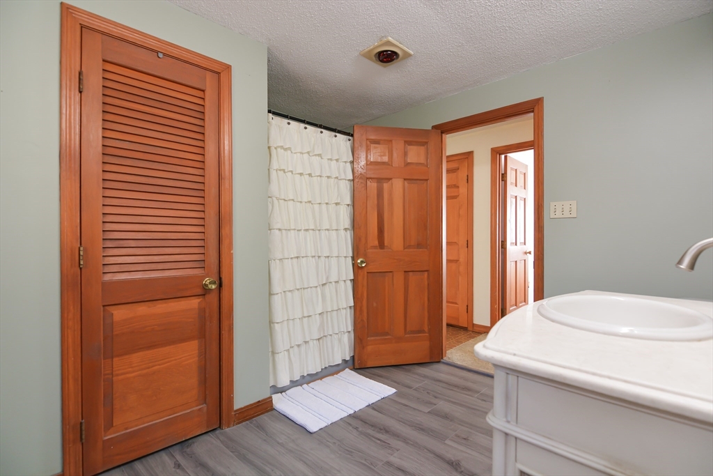 73 Drew Road Derry, NH 03038 - Photo 20 of 42 a view of bathroom with a sink and a mirror