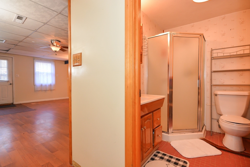 73 Drew Road Derry, NH 03038 - Photo 28 of 42 a bathroom with a toilet and a shower