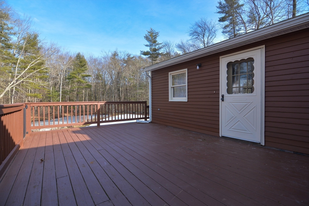 73 Drew Road Derry, NH 03038 - Photo 36 of 42 a view of a house with a roof deck