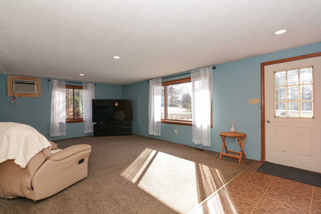 73 Drew Road Derry, NH 03038 - Photo 4 of 42 a living room with furniture and a window