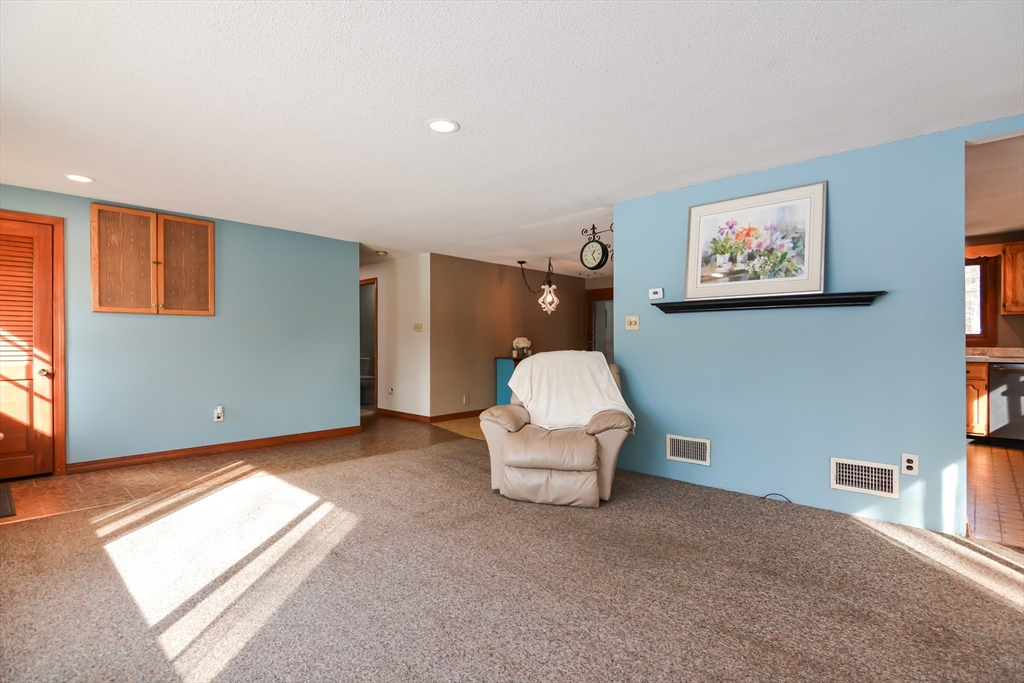 73 Drew Road Derry, NH 03038 - Photo 5 of 42 a view of a livingroom with furniture