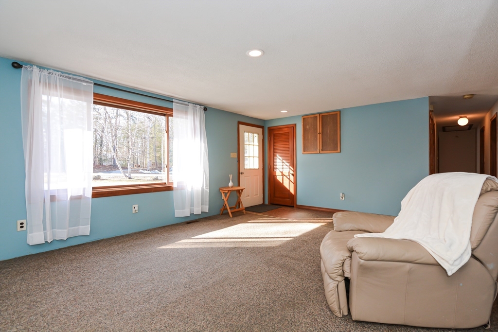 73 Drew Road Derry, NH 03038 - Photo 6 of 42 a living room with furniture and a window