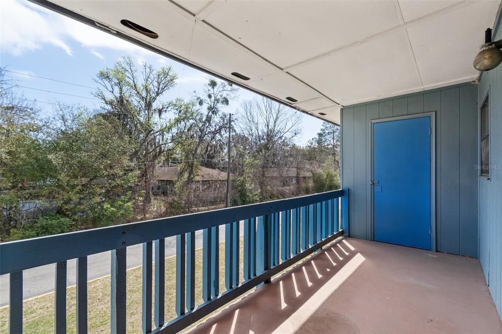2811 Southwest Archer Road, Unit A2 Gainesville, FL 32608 - Photo 18 of 26 a view of balcony with wooden fence