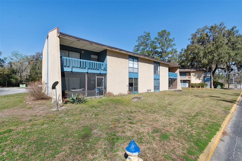 2811 Southwest Archer Road, Unit A2 Gainesville, FL 32608 - Photo 2 of 26 a house view with a backyard space