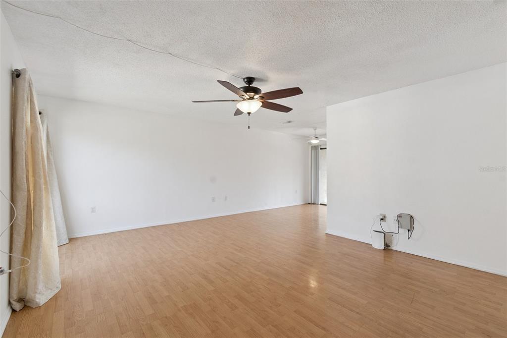 2811 Southwest Archer Road, Unit A2 Gainesville, FL 32608 - Photo 4 of 26 wooden floor in an empty room