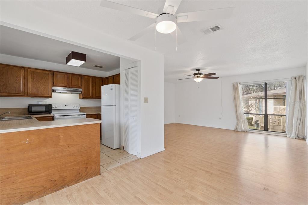 2811 Southwest Archer Road, Unit A2 Gainesville, FL 32608 - Photo 9 of 26 a kitchen with refrigerator and cabinets