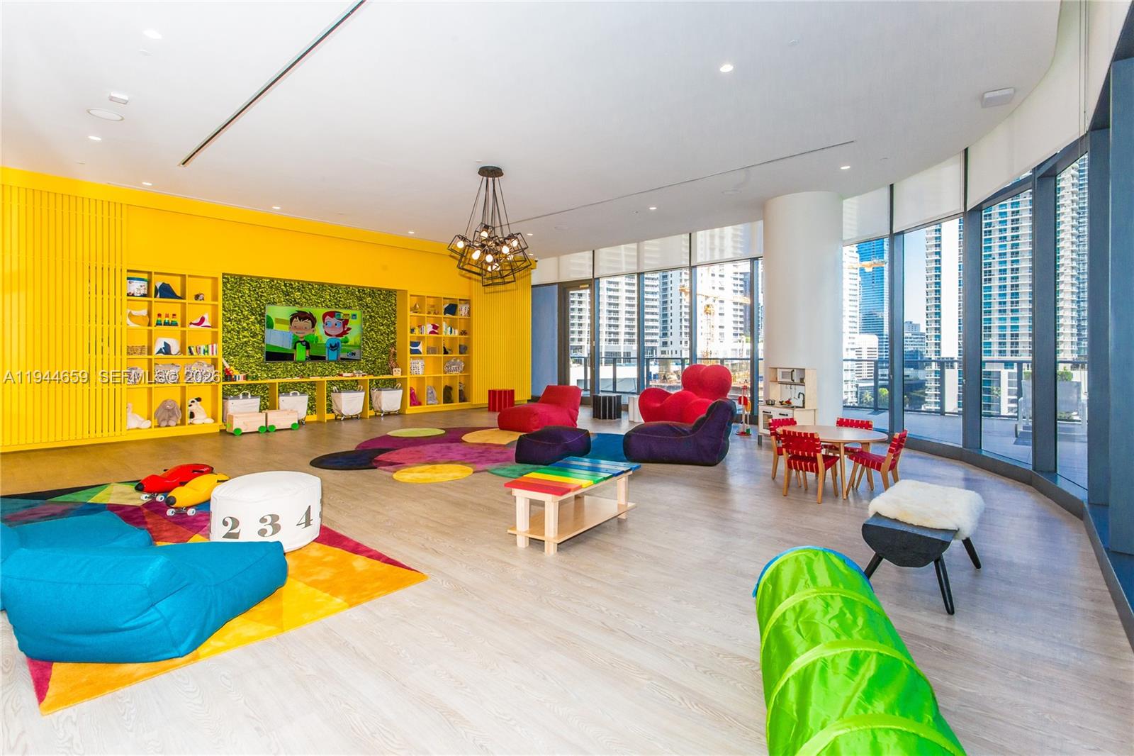 55 Southwest 9th Street, Unit 2107 Miami, FL 33130 - Photo 18 of 18 a living room with furniture kitchen view and a large window