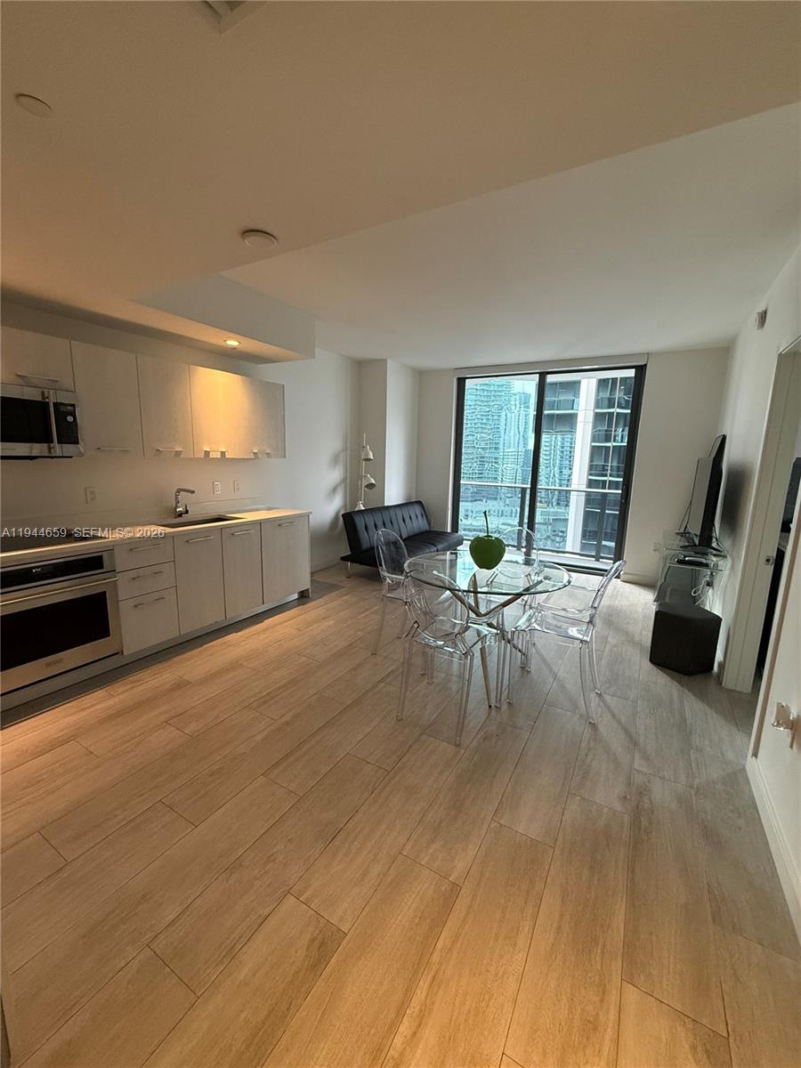 55 Southwest 9th Street, Unit 2107 Miami, FL 33130 - Photo 2 of 18 a very nice looking room with a large window