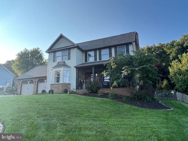 345 Jasmine Drive Hanover, PA 17331 - Photo 1 of 80 a front view of a house with a yard and trees
