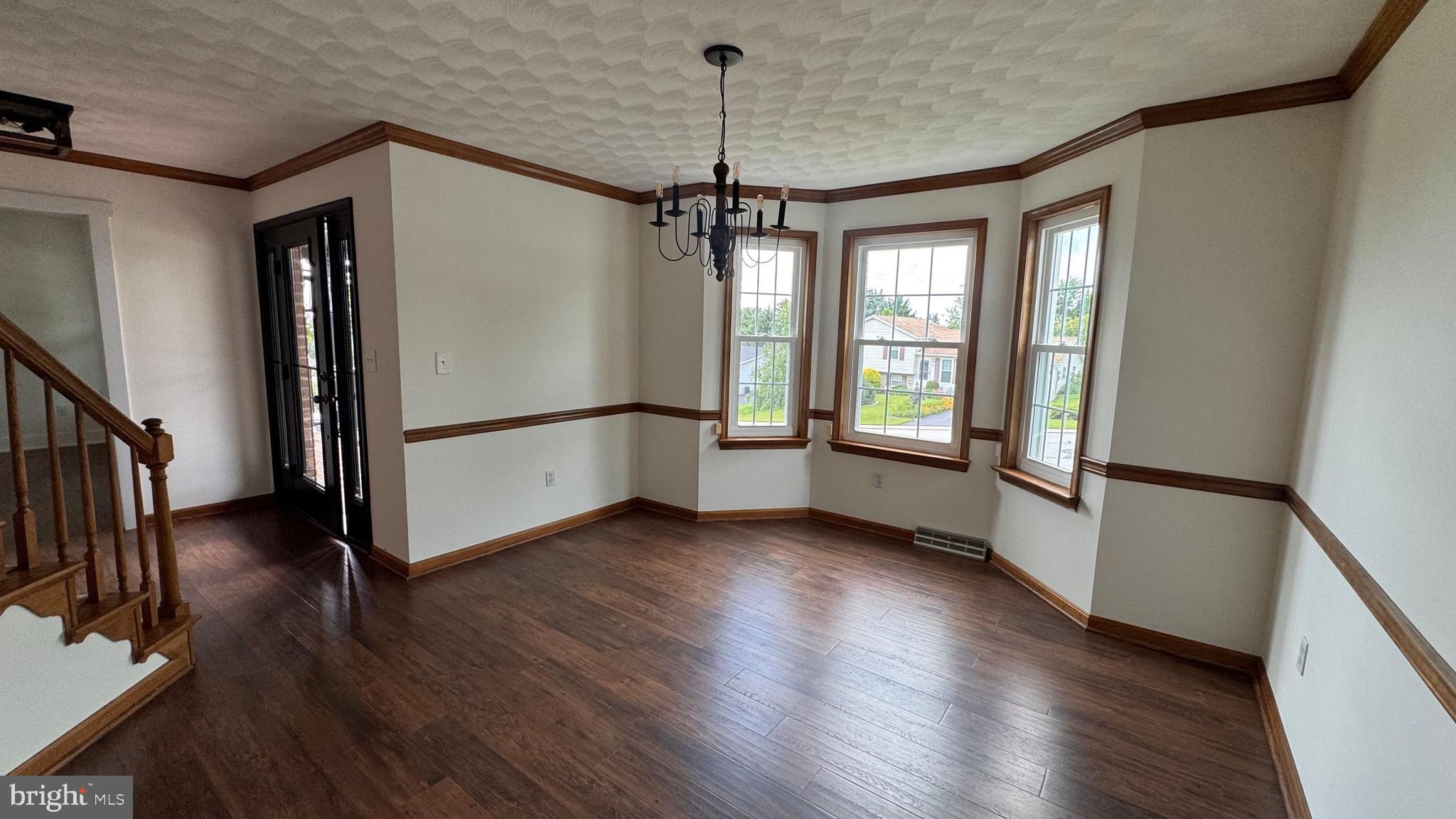 345 Jasmine Drive Hanover, PA 17331 - Photo 12 of 80 a view of an empty room with wooden floor and a window
