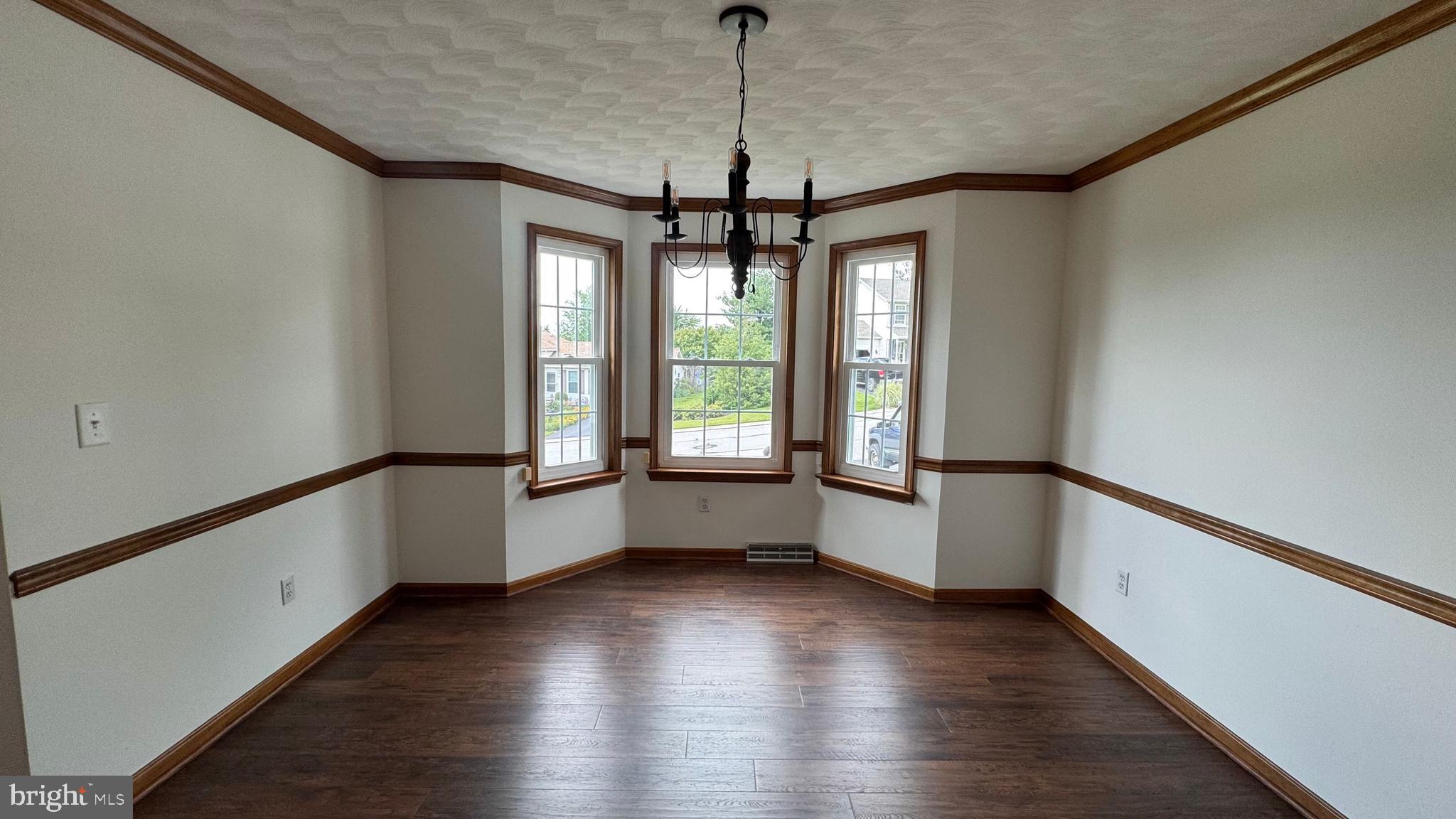 345 Jasmine Drive Hanover, PA 17331 - Photo 14 of 80 a view of an empty room with window and wooden floor