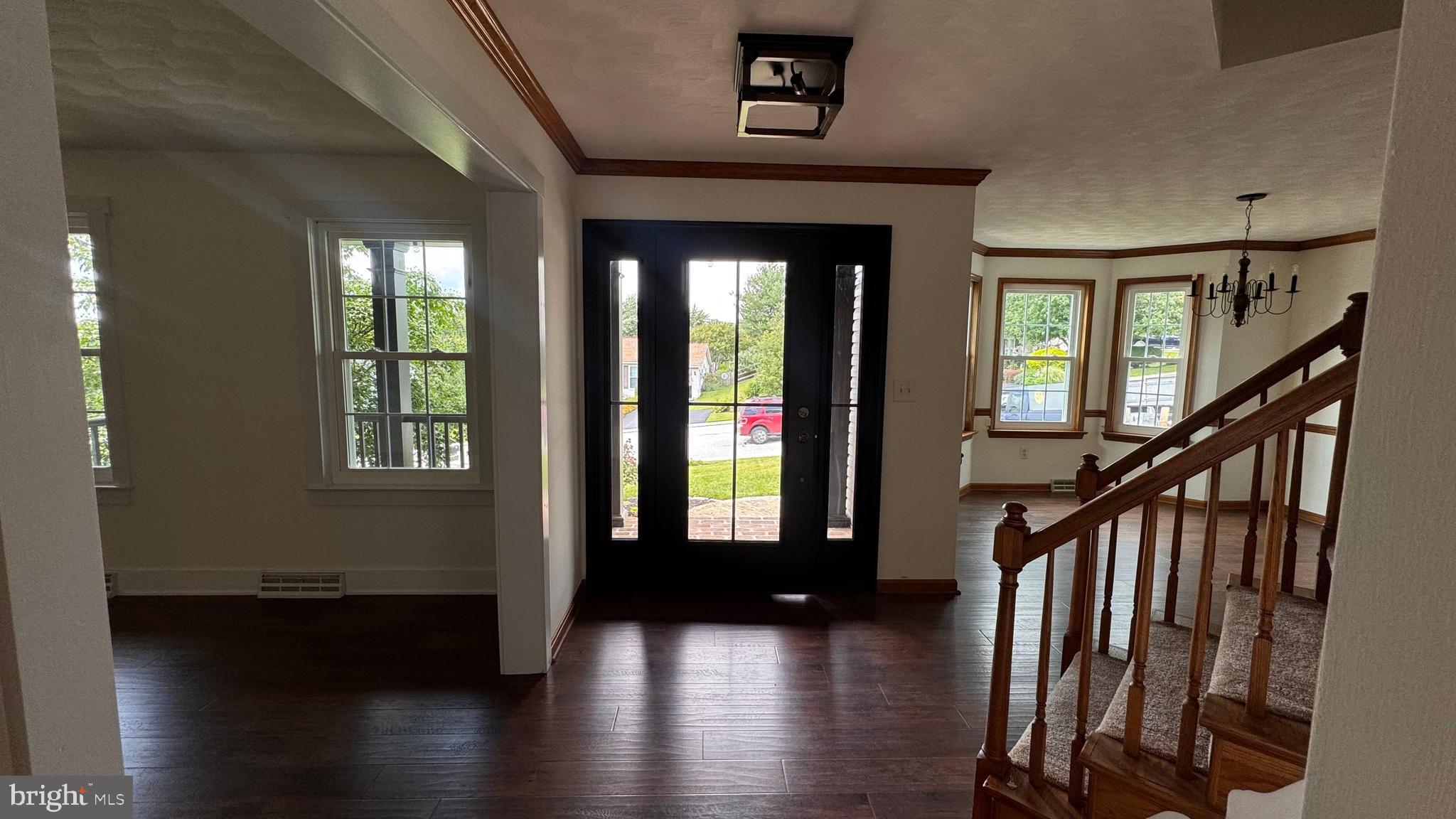 345 Jasmine Drive Hanover, PA 17331 - Photo 16 of 80 a view of a hallway with wooden floor and stairs