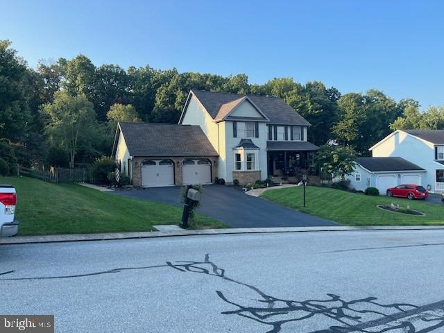 345 Jasmine Drive Hanover, PA 17331 - Photo 3 of 80 a front view of a house with a yard and garage