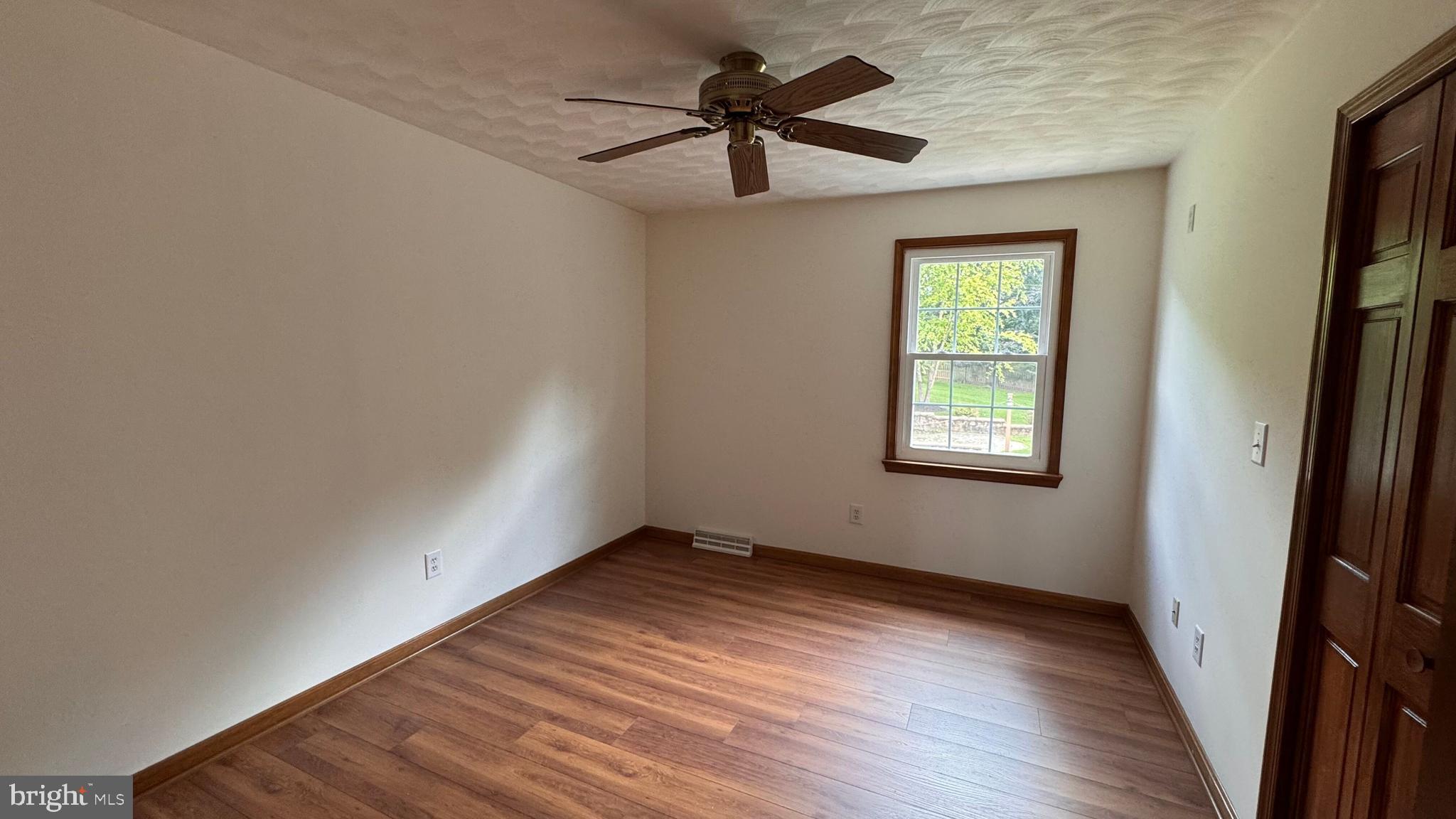 345 Jasmine Drive Hanover, PA 17331 - Photo 36 of 80 wooden floor in an empty room with a window