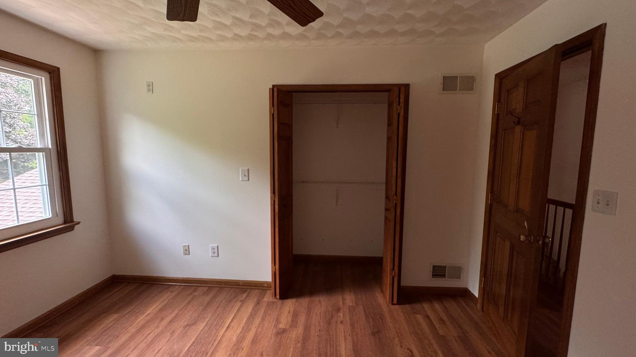 345 Jasmine Drive Hanover, PA 17331 - Photo 38 of 80 an empty room with wooden floor and a window