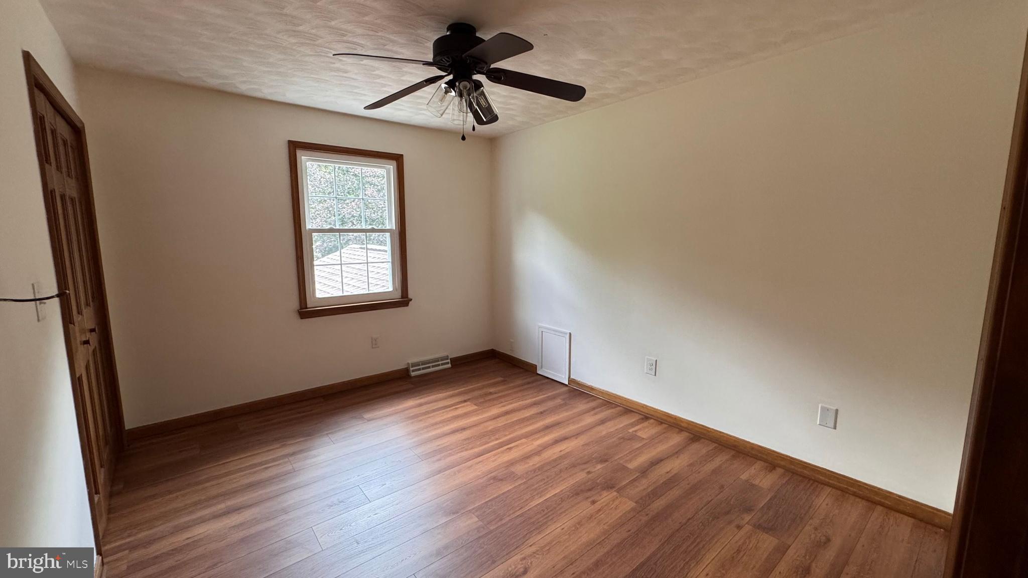 345 Jasmine Drive Hanover, PA 17331 - Photo 42 of 80 a view of empty room with wooden floor and fan