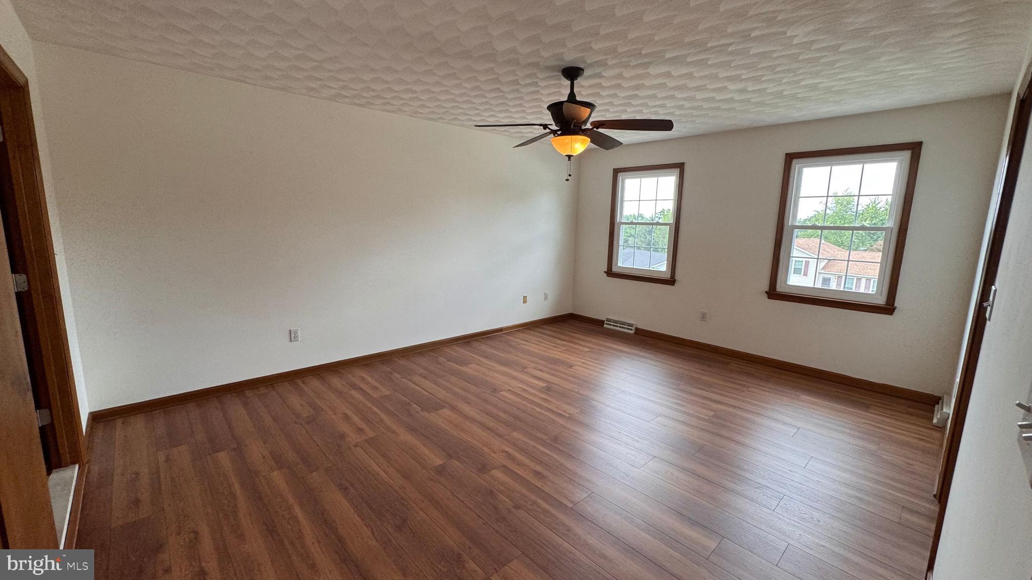 345 Jasmine Drive Hanover, PA 17331 - Photo 47 of 80 an empty room with windows and wooden floor