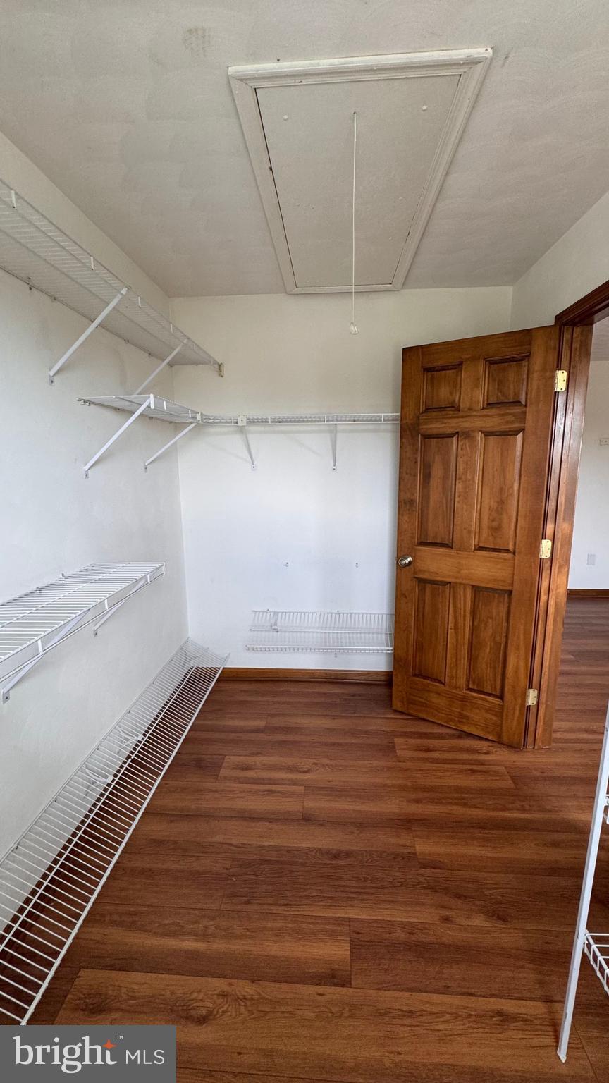 345 Jasmine Drive Hanover, PA 17331 - Photo 50 of 80 a view of an empty room with wooden floor and a window