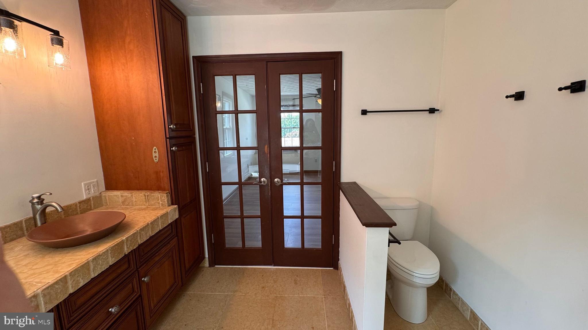 345 Jasmine Drive Hanover, PA 17331 - Photo 55 of 80 a bathroom with a granite countertop sink toilet and shower
