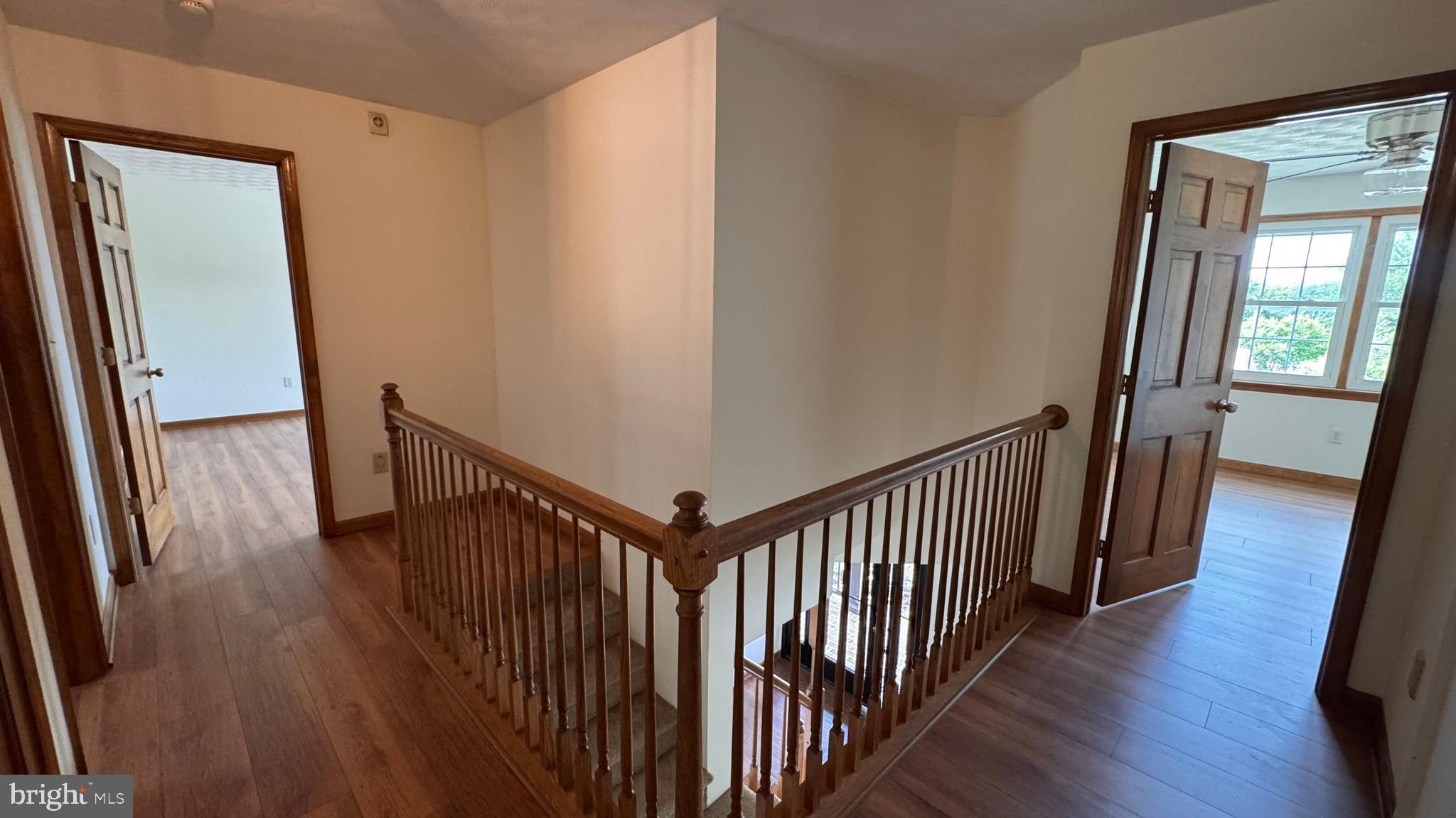 345 Jasmine Drive Hanover, PA 17331 - Photo 64 of 80 a view of a hallway with wooden floor and stairs