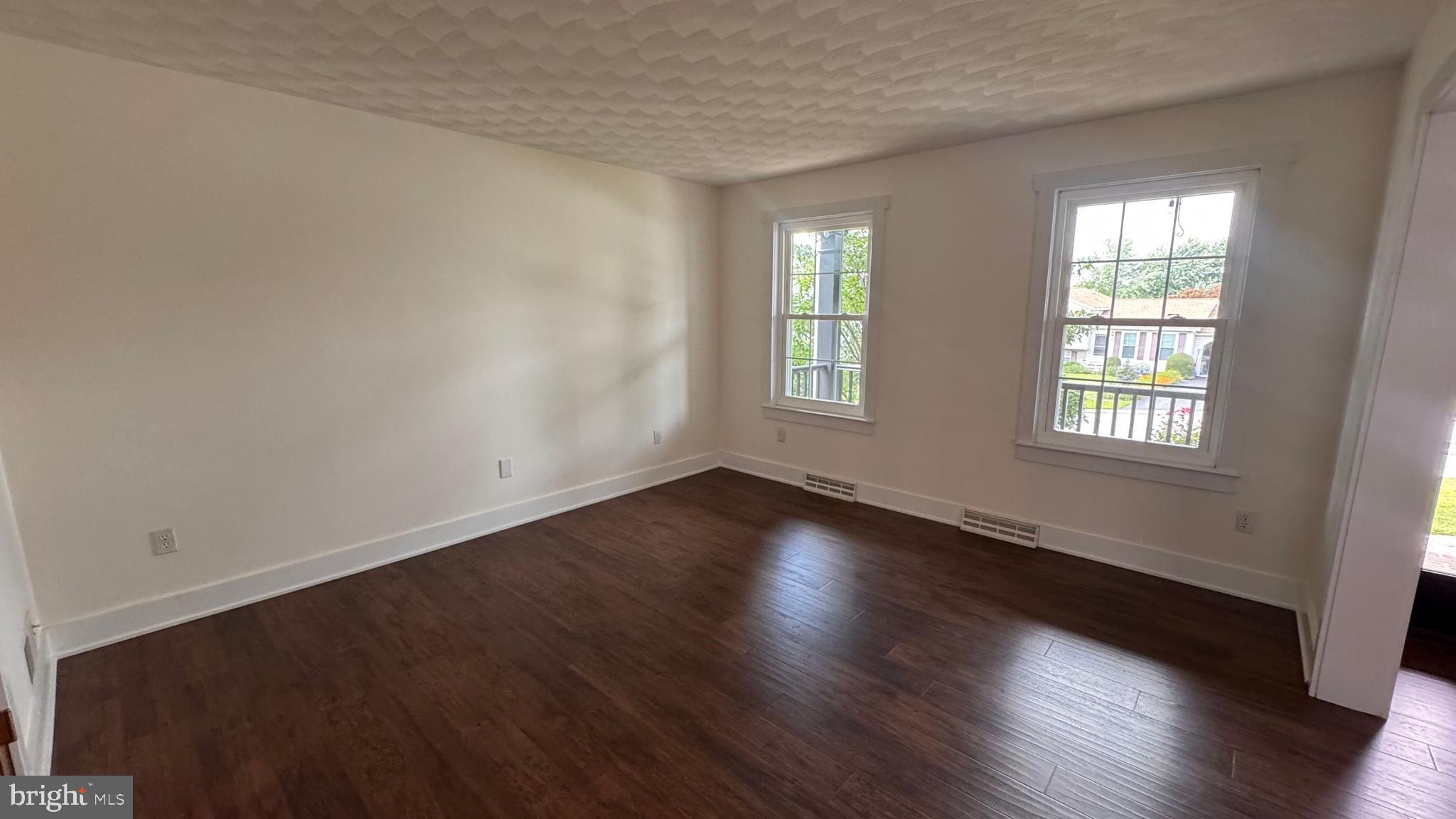 345 Jasmine Drive Hanover, PA 17331 - Photo 9 of 80 an empty room with wooden floor and windows