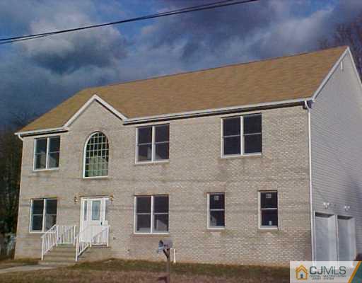 11 Miko Road Edison, NJ 08817 - Photo 1 of 8 a front view of a house with large windows