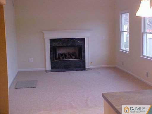 11 Miko Road Edison, NJ 08817 - Photo 4 of 8 an empty room with a fireplace