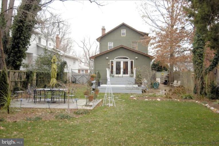 26 West Braddock Road Alexandria, VA 22301 - Photo 1 of 30 a view of a house with a big yard and large trees