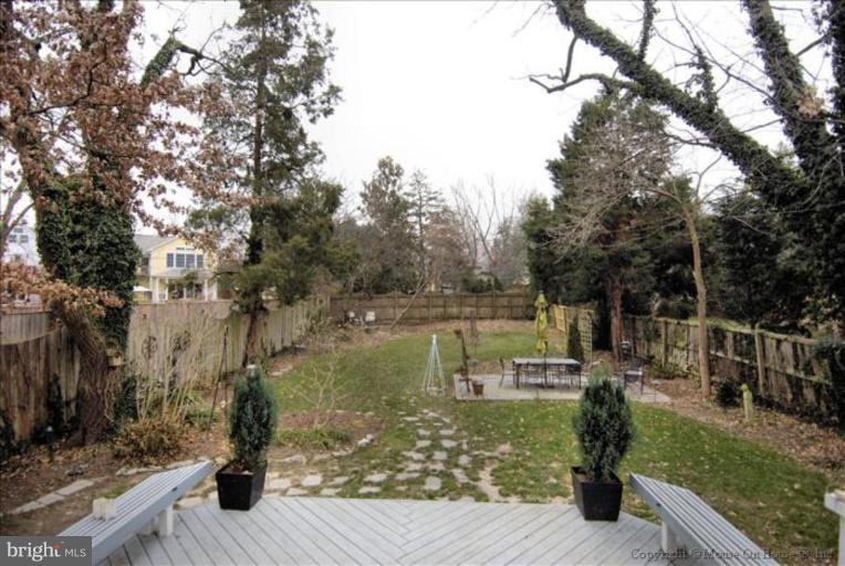 26 West Braddock Road Alexandria, VA 22301 - Photo 3 of 30 a view of a wooden deck next to a yard
