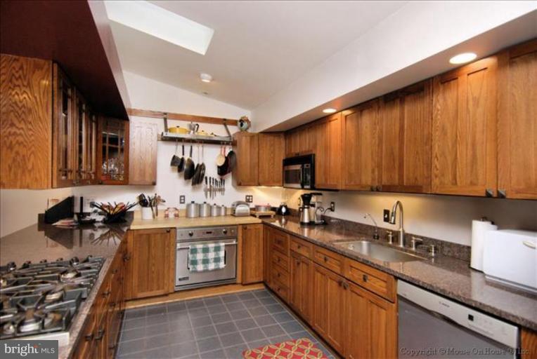 26 West Braddock Road Alexandria, VA 22301 - Photo 10 of 30 a kitchen with a sink and cabinets